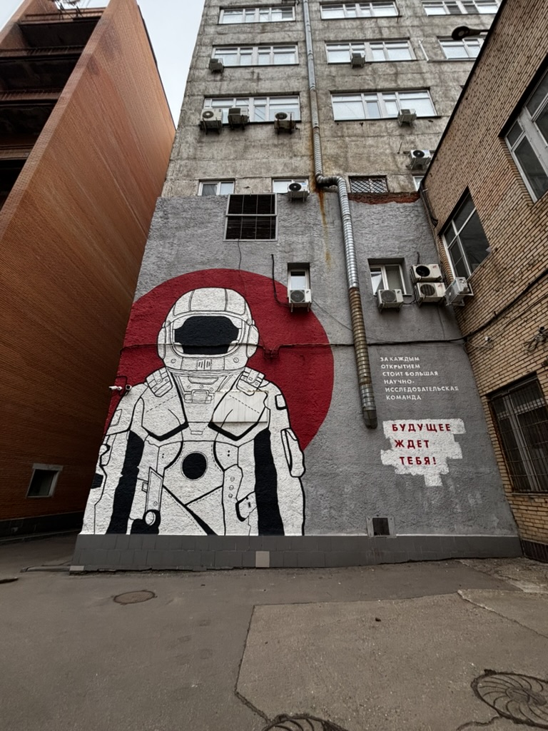 An astronaut mural on a campus building