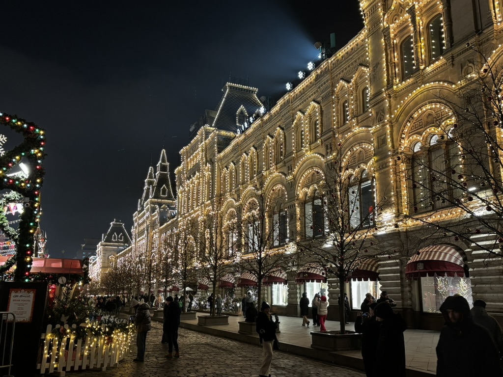 A Moscow shopping arcade decorated with lights at night