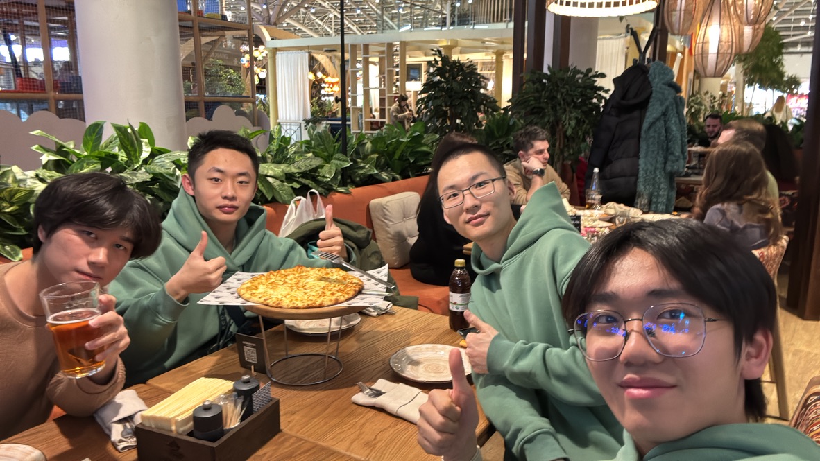 Friends sharing a meal together during the trip