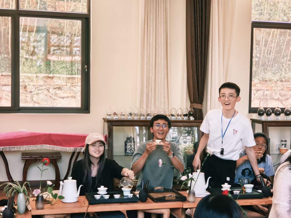Participants sharing a traditional tea experience